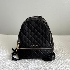 Black Michael Kors backpack.